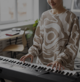 Woman playing a piano in her home
